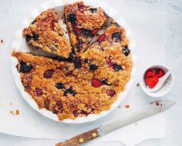 Here’s a recipe for a tender coffee cake bursting with jammy berries and topped with a buttery streusel.