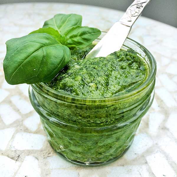 Preserve bright summer herbs by making and freezing pesto. Frozen pesto adds summer sunshine to dishes all year long.