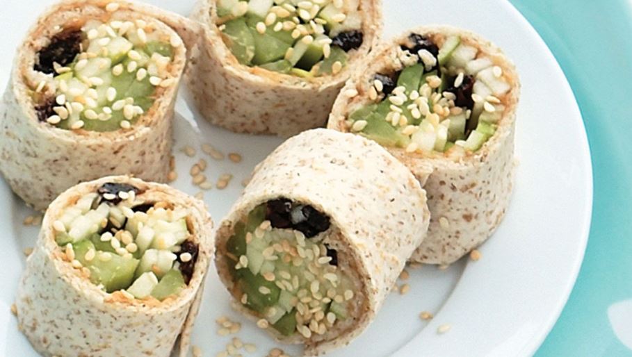 Assemble tortilla with peanut butter, apple, celery and blueberries